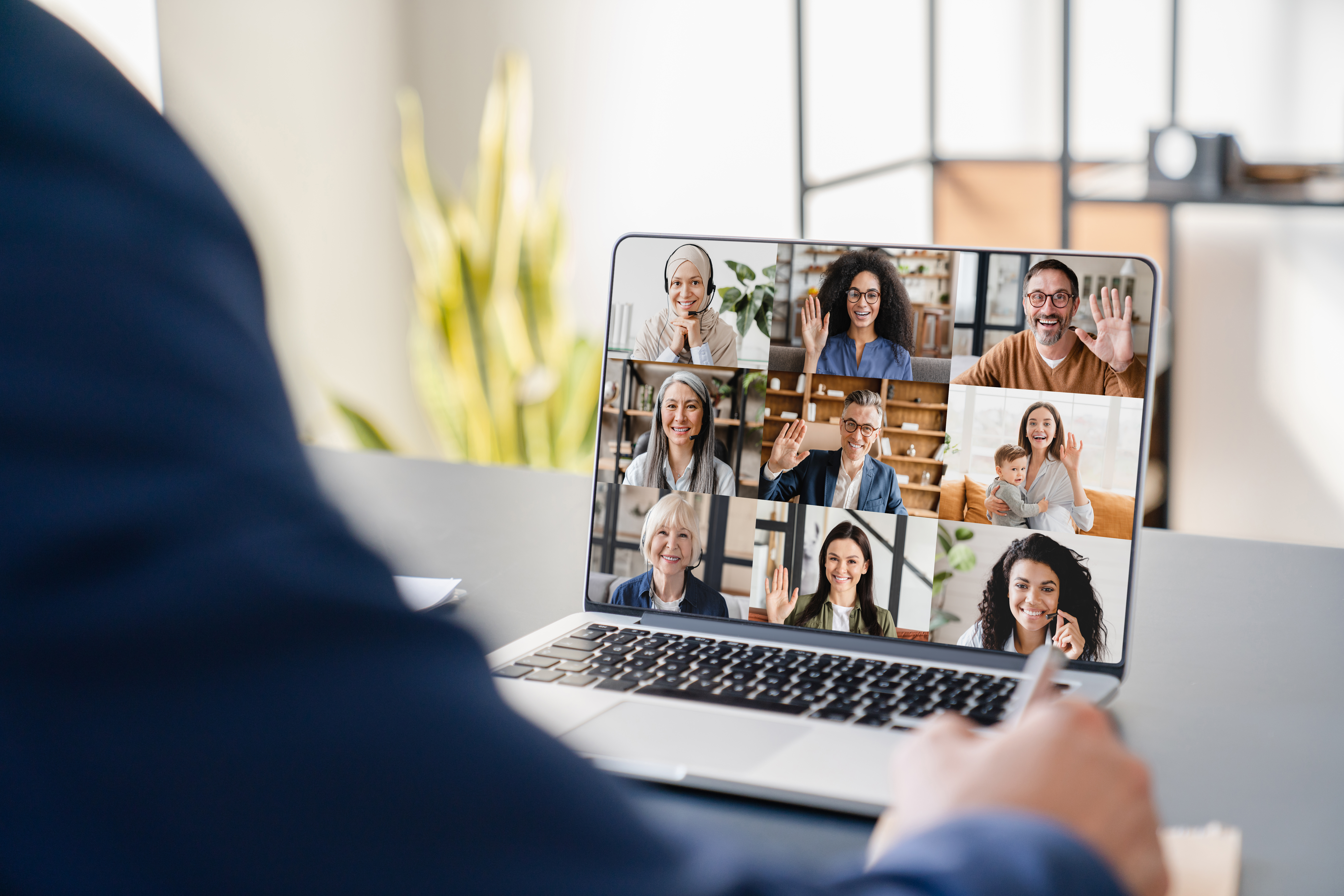 Illustration of a remote team participating in a virtual All-Hands meeting with multiple faces on a video call grid, clean modern design, and warm collaborative atmosphere.